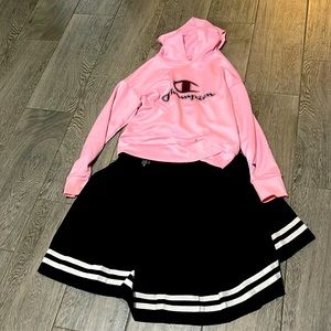 The skirt brand is hot topic The brand of the hoodie is champion